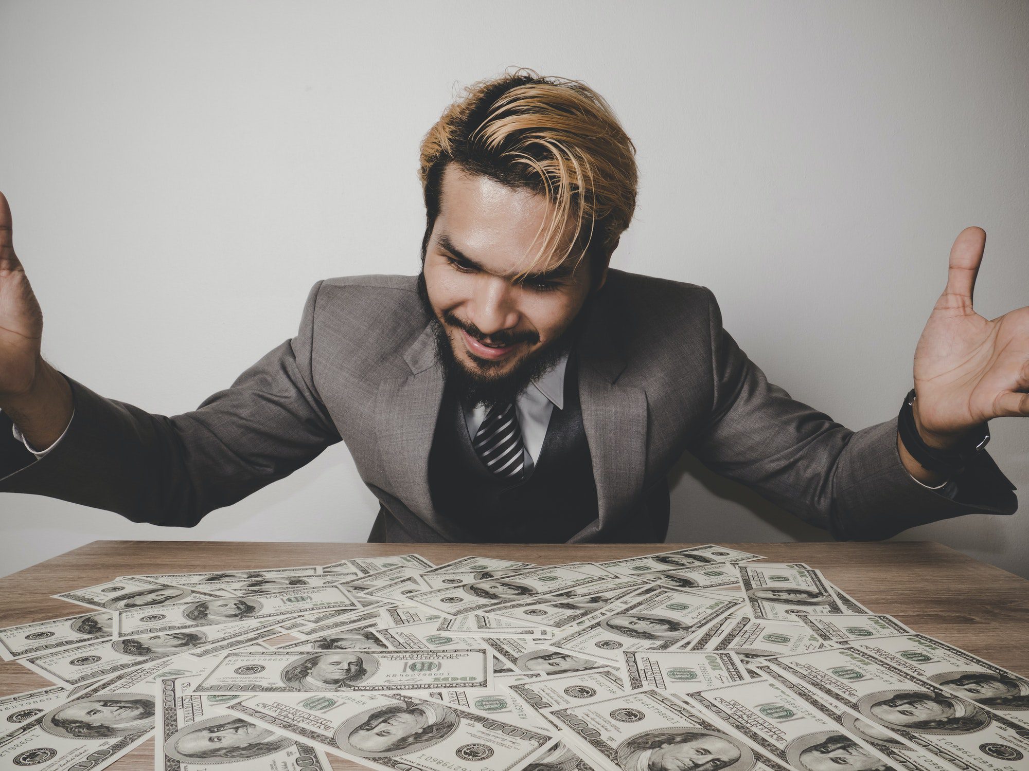 businessman happy with many dollar banknote, business success concept