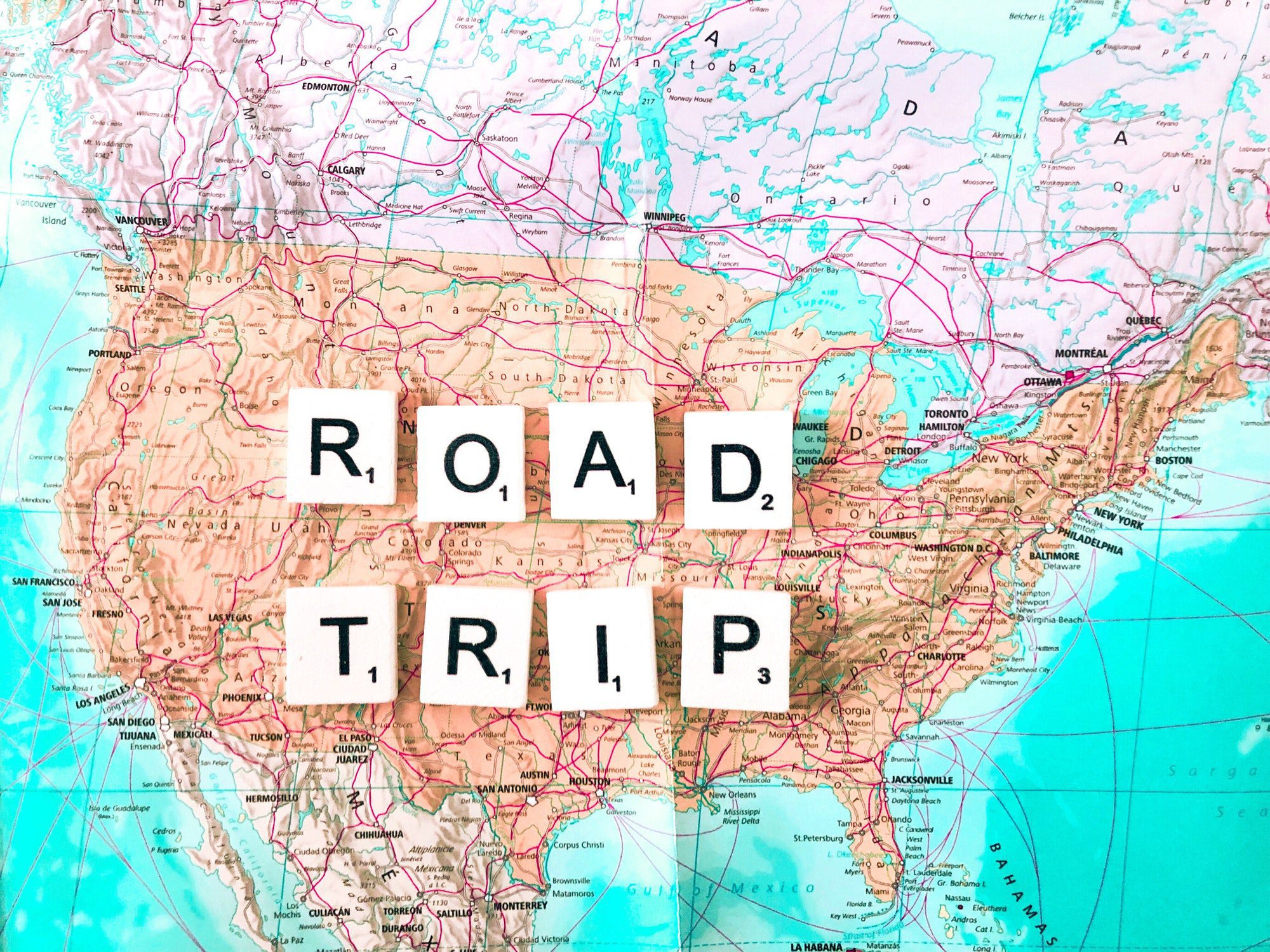 The letters "Road Trip" spelled out on a map of the United States
