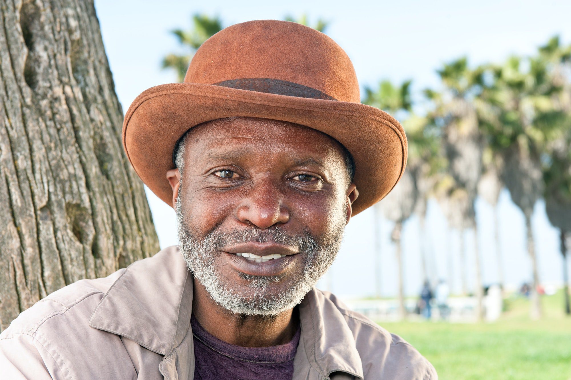 Elderly man smiling after finding out what options are available to him in medicare.