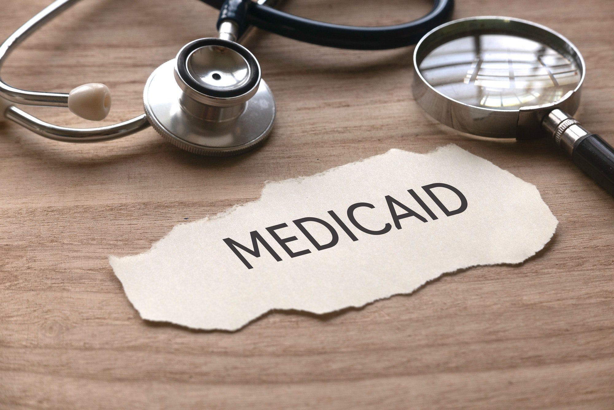 Medicaid spelled out on a sheet of paper referring to how it works with Medicare Premiums.