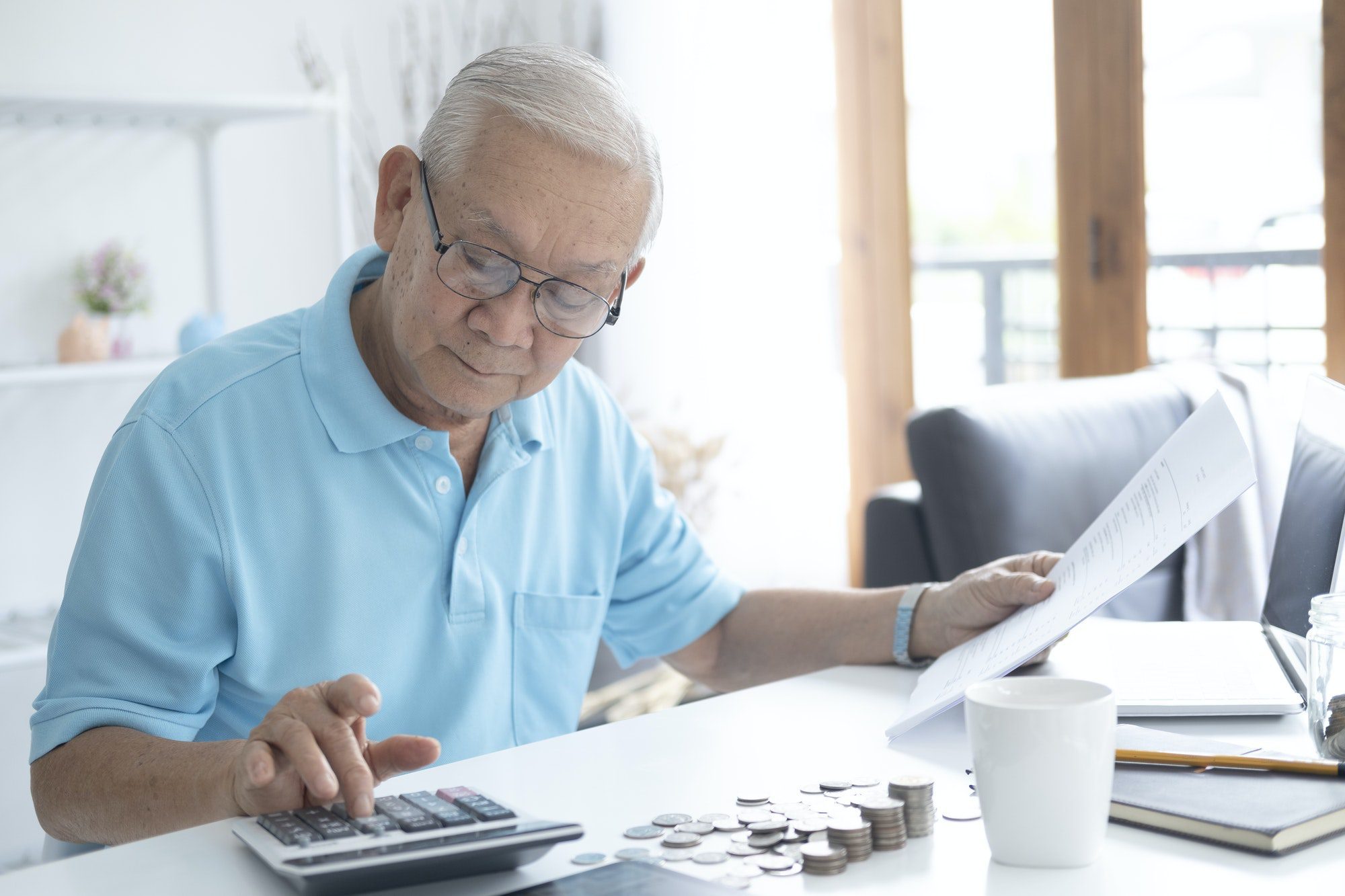 Senior man calculating how much to invest in Health Matching Account (HMA’s).