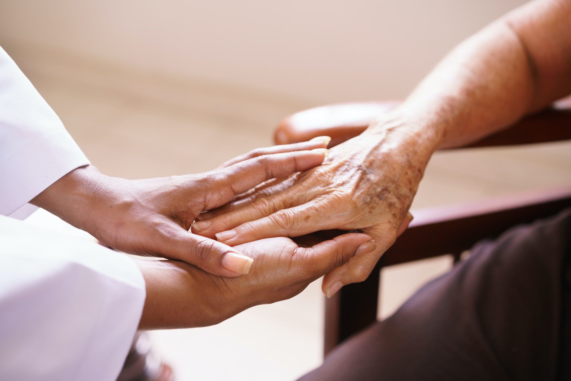 A senior woman discussing what Hospice Care is not covered by Medicare.