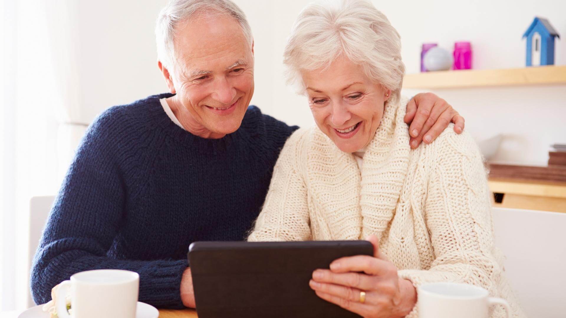Seniors checking medicare plan comparison on tablet - BBI